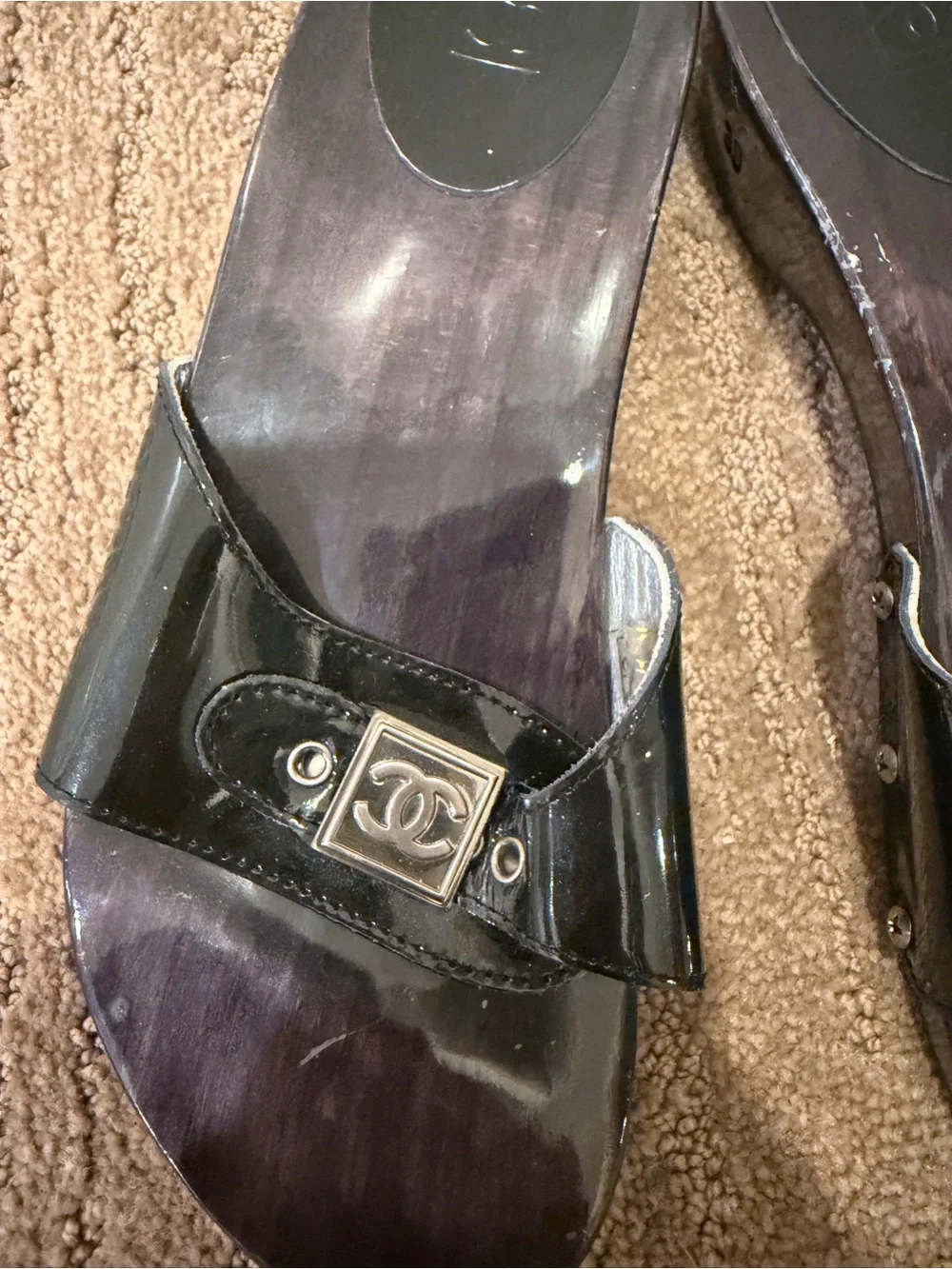 CHANEL Black Patent Leather Slide Mules with Silver Logo Plaque